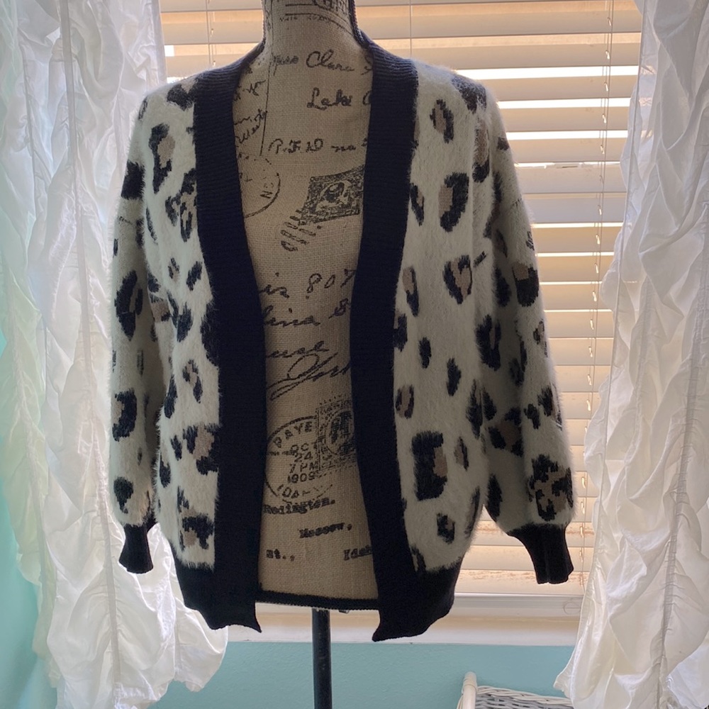 Leopard print sweater by Storia size small.